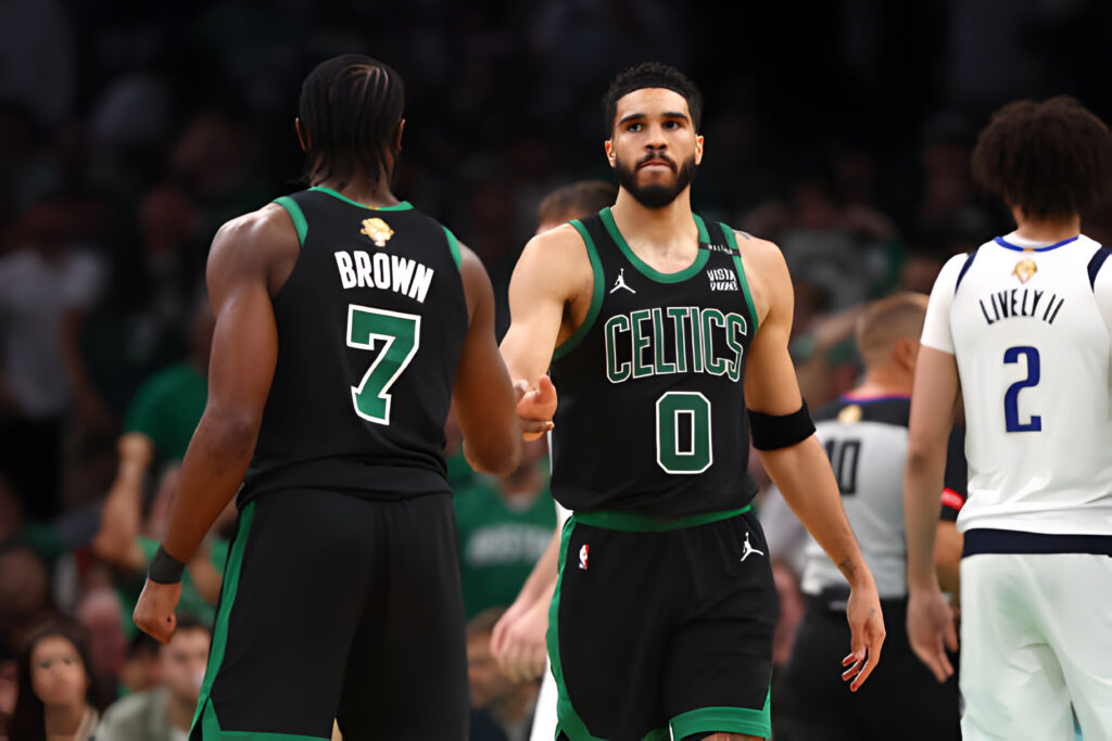 Jayson Tatum #0 and Jaylen Brown #7 of the Boston Celtics high give during the third quarter against the Dallas Mavericks in Game Two of the 2024 NBA Finals at TD Garden on June 09, 2024 in Boston, Massachusetts