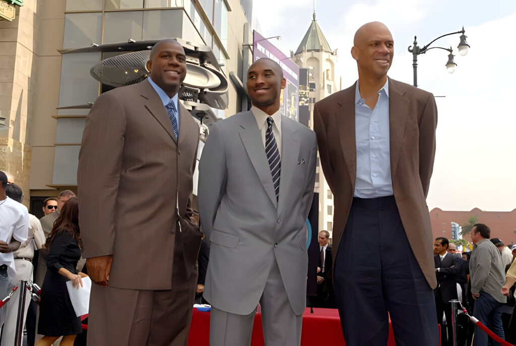 Earvin "Magic" Johnson, Kobe Bryant and Kareem Abdul-Jabbar pose together at the ceremony for Dr. Jerry Buss, owner of the Los Angeles Lakers, as he is given a television star on the Hollywood Walk of Fame on October 30, 2006 in Hollywood, California.