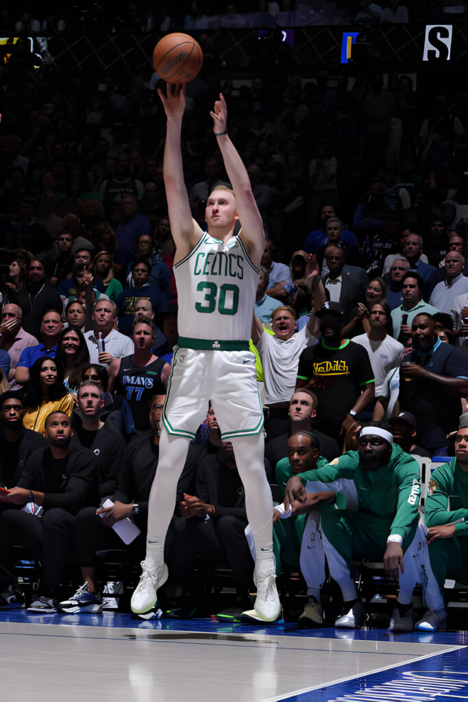 Sam Hauser #30 of the Boston Celtics shoots a three point basket during the game against the Dallas Mavericks during Game 3 of the 2024 NBA Finals on June 12, 2024 at the American Airlines Center in Dallas, Texas.